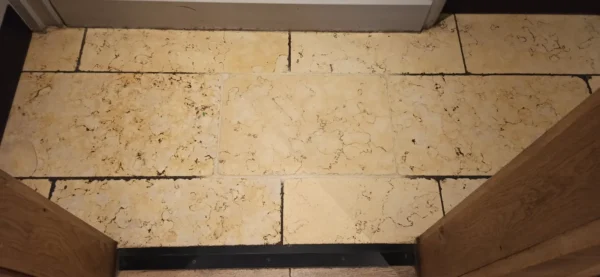 stone-grout-cleaning-test-limestone Limestone floor test patch showing cleaned stone and grout next to dirty grout